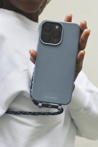 a person holding a cell phone in their hand