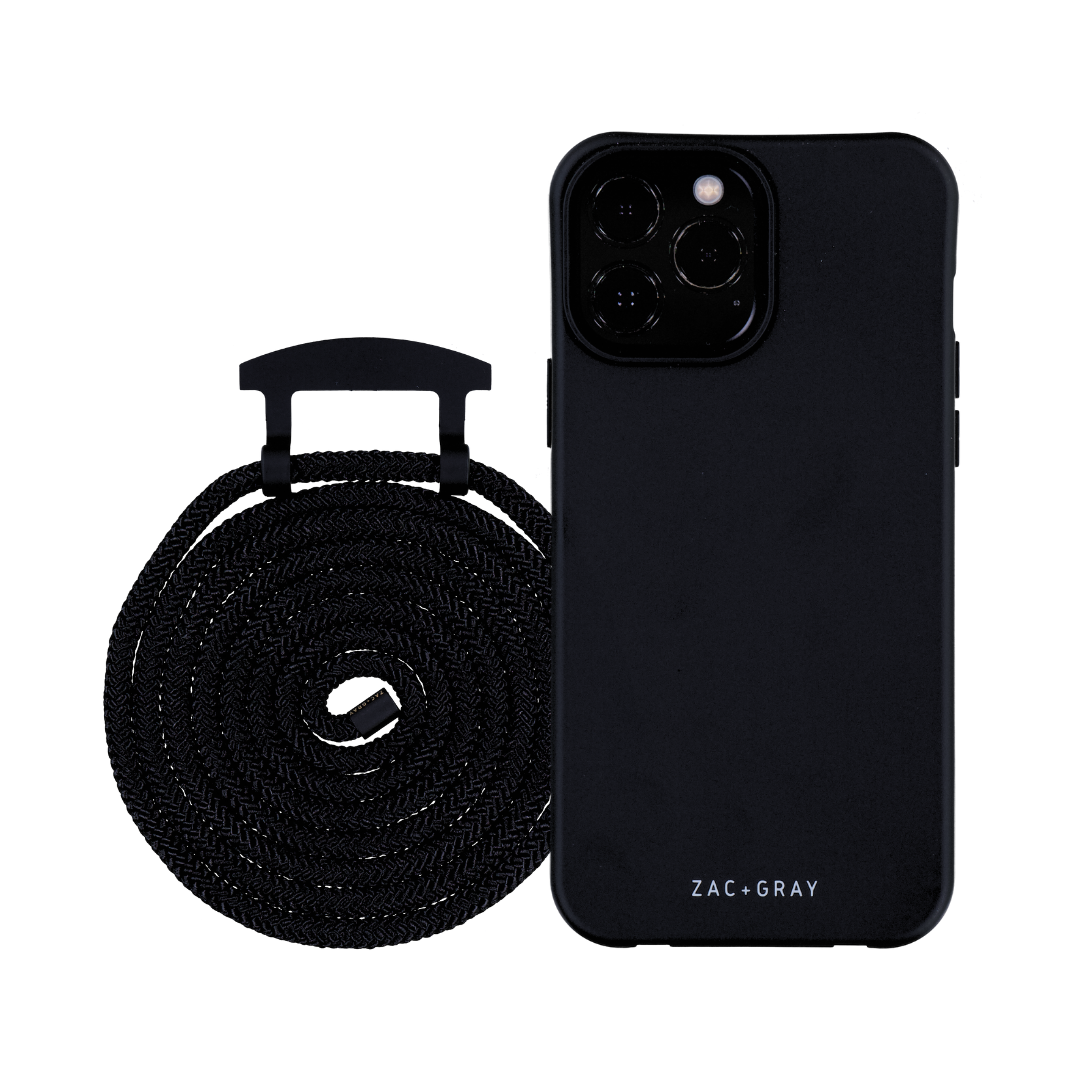 a black case next to a black phone