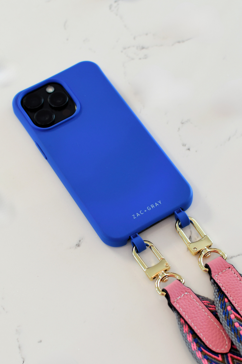 a blue phone case sitting on top of a white counter