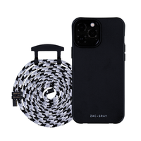 a black and white phone case next to a white and black cable